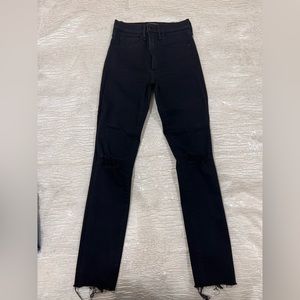 Brand new black skinny jeans with ripped details